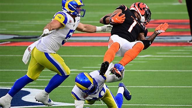  Cincinnati Bengals receiver Ja'Marr Chase (1) is upended after a reception against the Los Angeles Rams in Super Bowl LVI at SoFi Stadium. -- Photo courtesy of Gary A. Vasquez-USA TODAY Sports