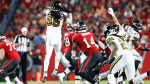 New Orleans Saints linebacker Demario Davis (56) makes an interception against the Tampa Bay Buccaneers during the second quarter at Raymond James Stadium. Mandatory Credit: Douglas DeFelice-USA TODAY Sports