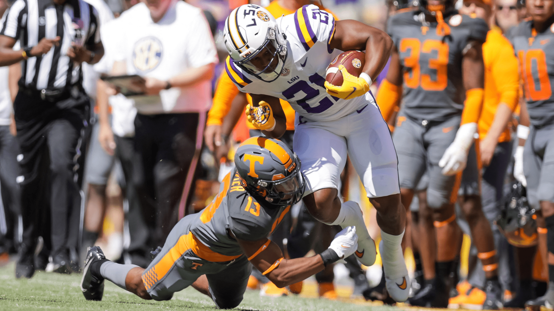 Tennessee Volunteers defensive back Wesley Walker (13) dives to tackle LSU Tigers running back Noah Cain (21) during the second half of Saturday's game at Tiger Stadium. -- Photo by Stephen Lew-USA TODAY Sports/Reuters