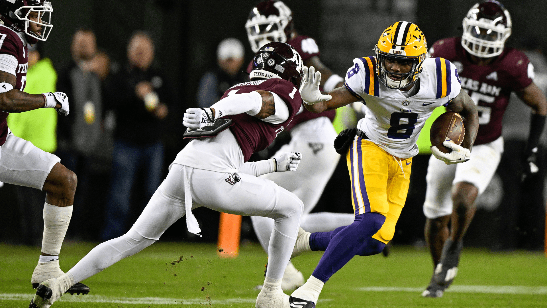 LSU wide receiver Malik Nabers (8) tries to elude Texas A&M Aggies defensive back Bryce Anderson (1) during the second quarter of Saturday's game at Kyle Field. -- Photo by Jerome Miron-USA TODAY Sports/Reuters
