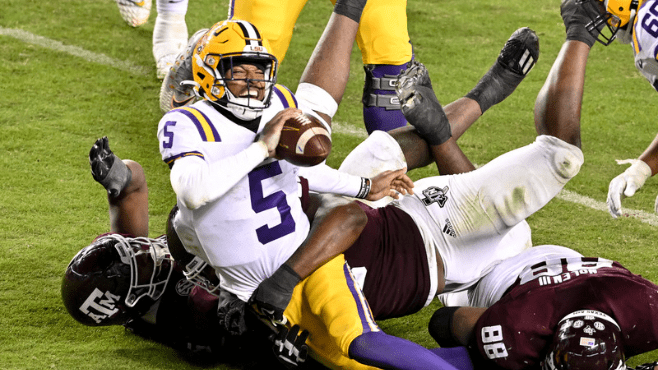 Texas A&M Aggies defensive lineman Shemar Turner (5) and defensive lineman McKinnley Jackson (35) sack LSU Tigers quarterback Jayden Daniels (5) during the fourth quarter at Kyle Field. -- Photo by Maria Lysaker-USA TODAY Sports / Reuters 
